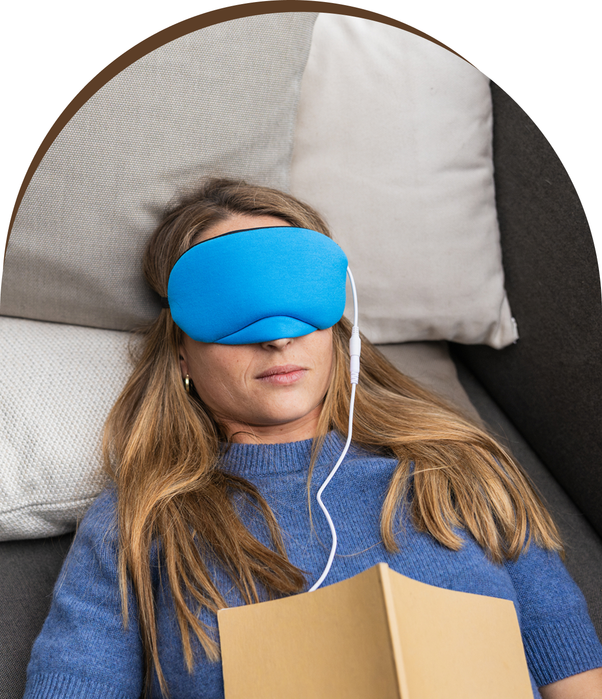 Group 1321317385 A woman laying on the ground wearing a blue eye mask.